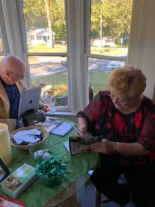 maxine signing a book